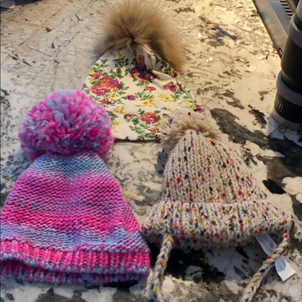 Three baby girl winter hats.
